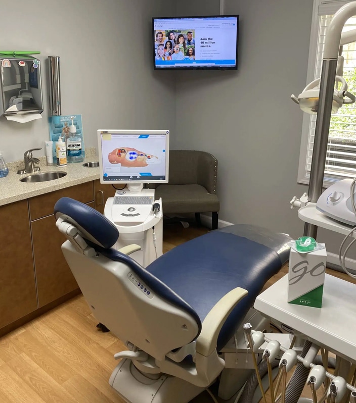 Dental examination chair and equipment in a modern operatory at Palatine Dental Associates.